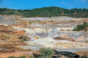 A vast industrial mining landscape in Minas de Riotinto, showcasing the earthy textures and mineral colors.