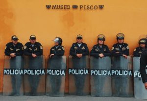 Peruvian police in uniform outside Museo del Pisco, Lima, Peru.