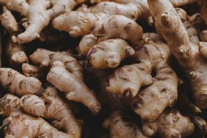 Detailed close-up of fresh ginger roots showcasing texture and organic form.