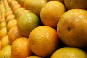 Vibrant fresh oranges stacked in rows, showcasing their juicy and nutritious appeal.